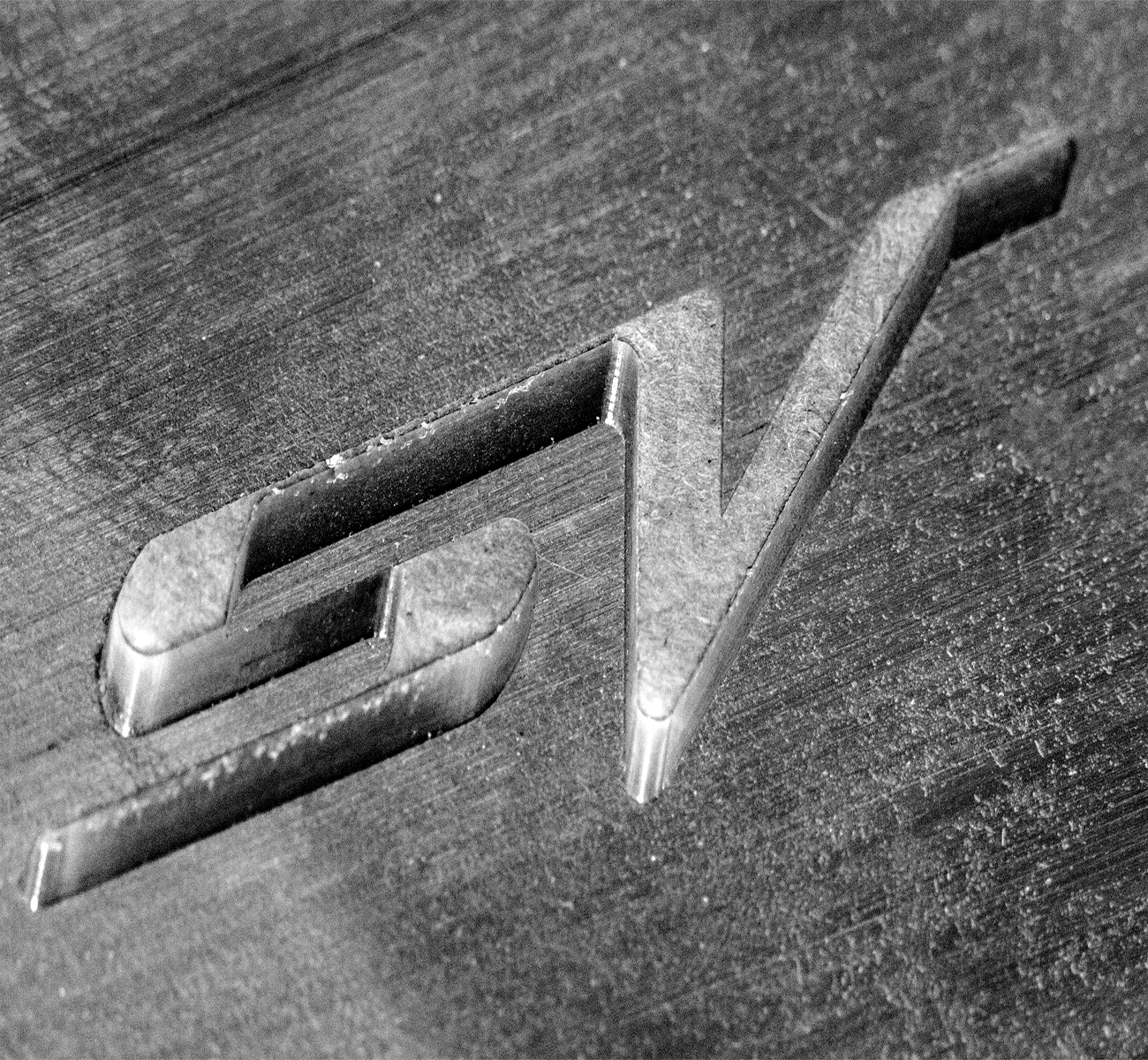SV yachts logo cut into metal