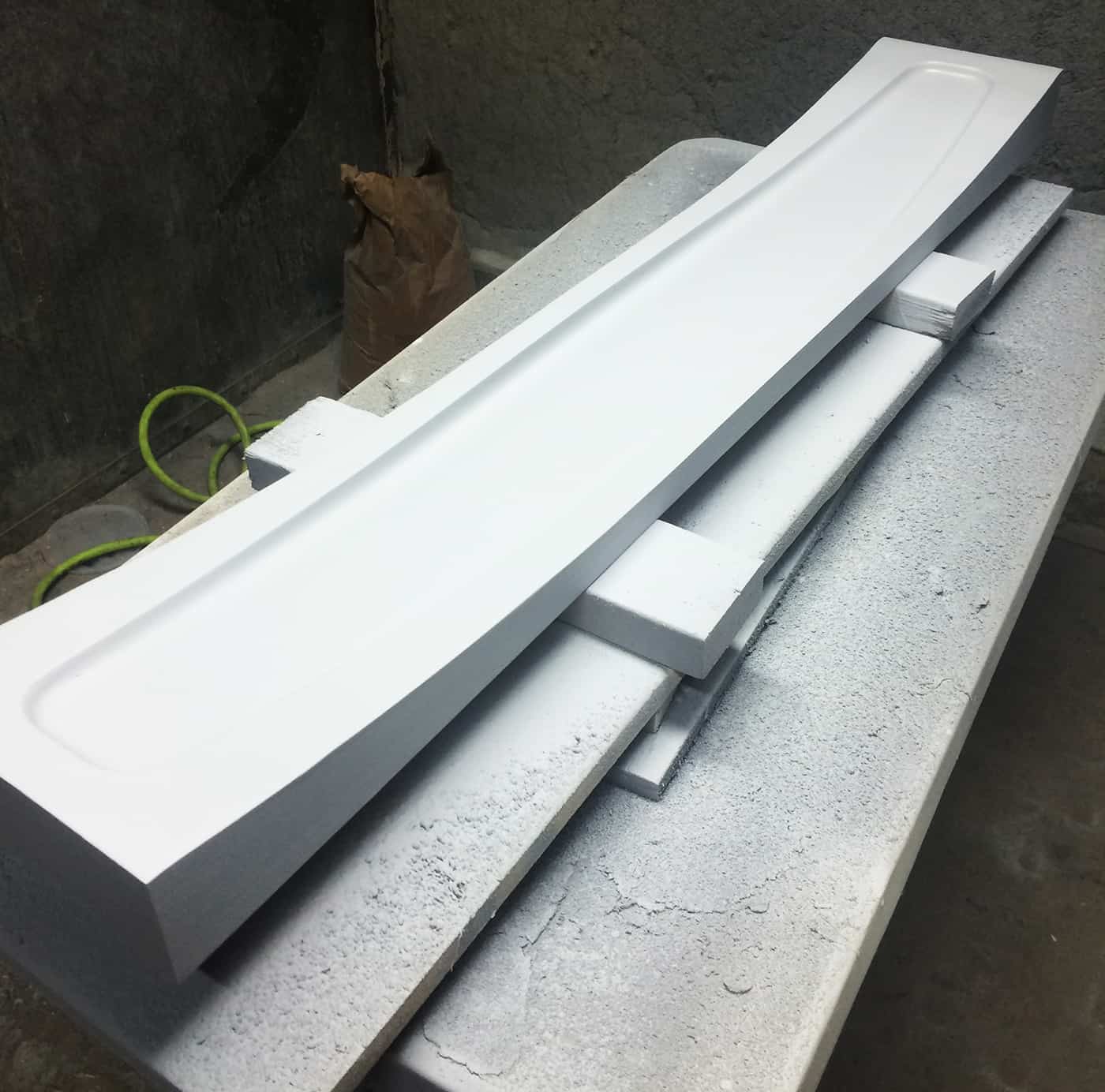 white mold for youth slalom ski after being painted white.