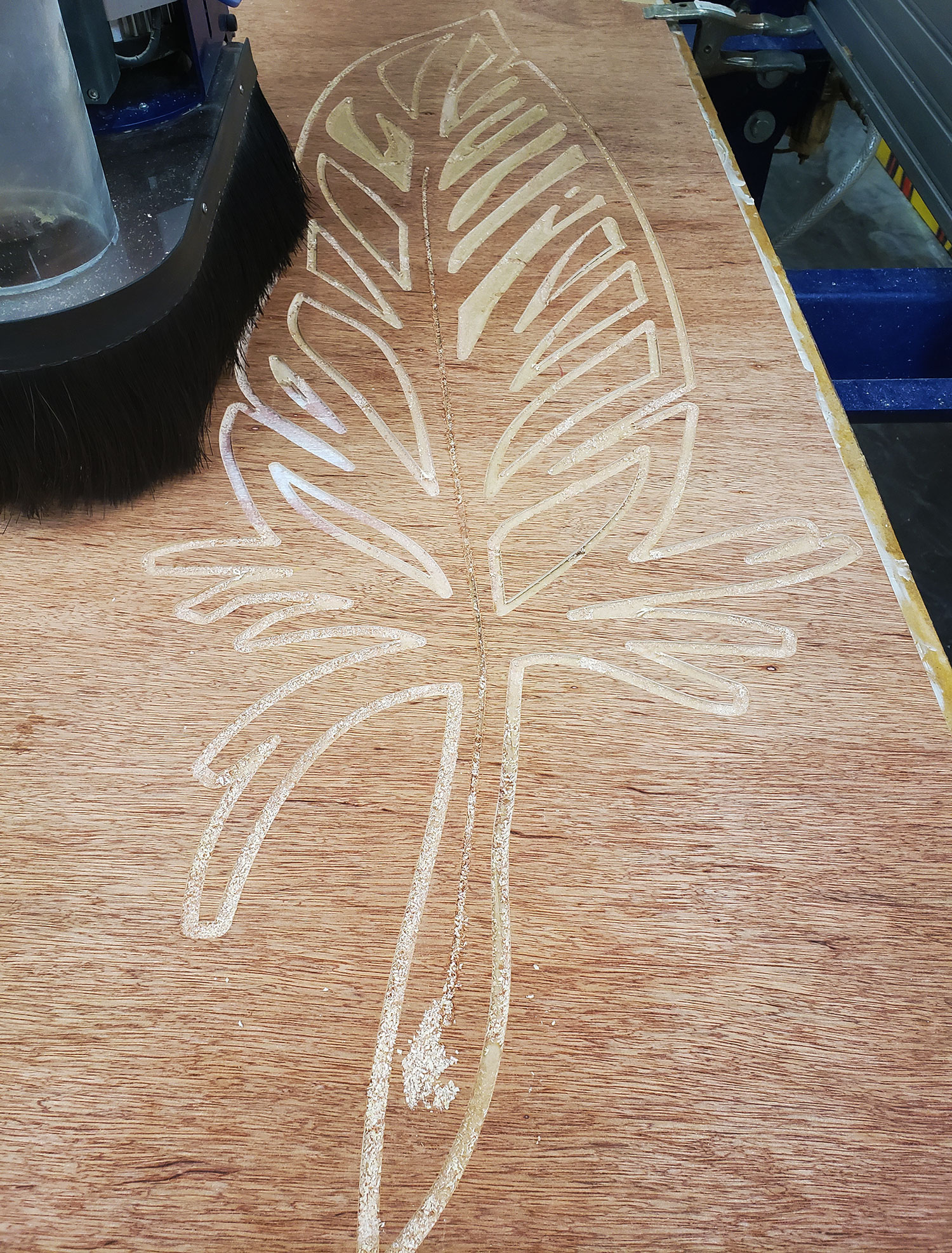 palm leaf cut out of wood on a cnc machine.
