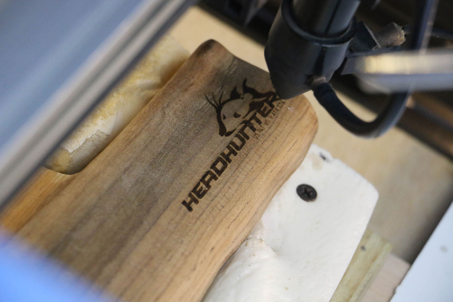 lasered Headhunter brand being engraved on handle of product.