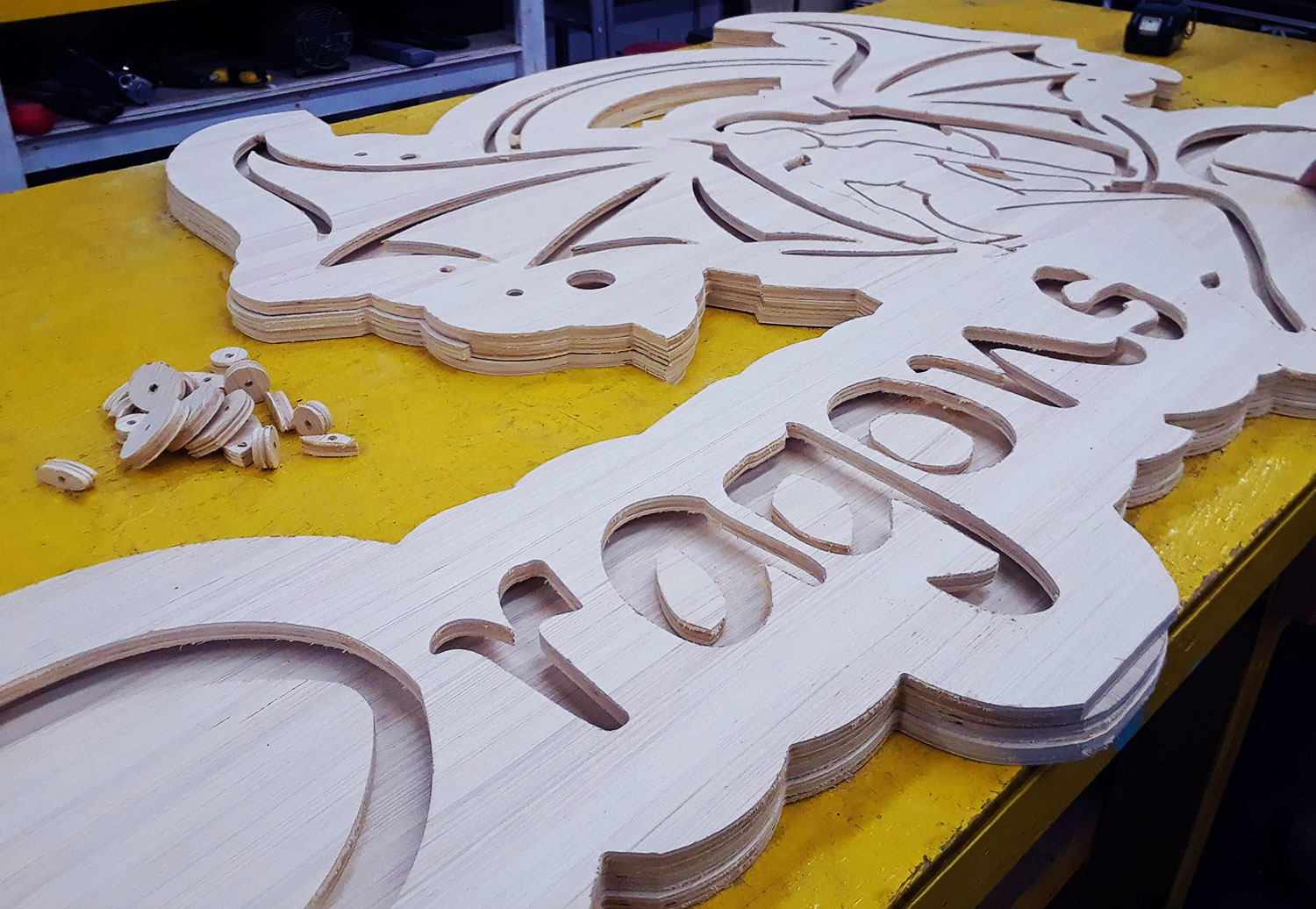 custom designed 3d sign made out of wood cut from cnc machine