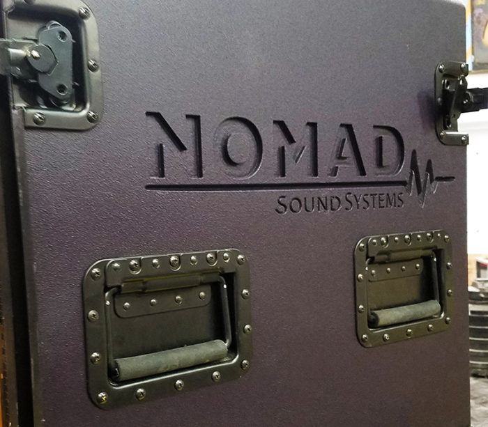 close up of the side of an amp rack with branding cut and handles