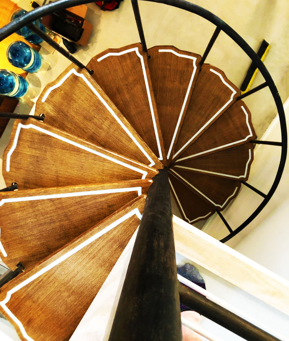 Overhead view of custom wooden winding stairs.