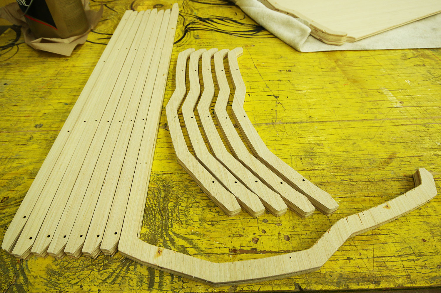 custom cut long and thin wooden pieces laid side by side.