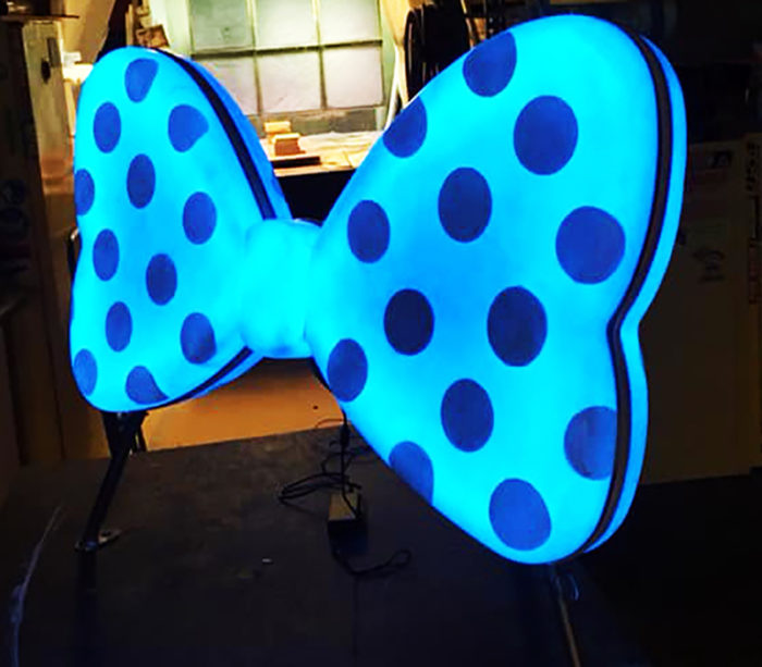 large lit up fiberglass bowtie with dots for decoration