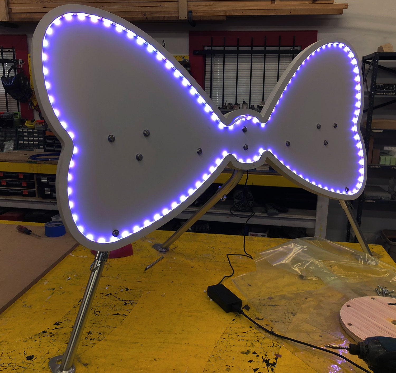 bowtie stand with LED lights around it
